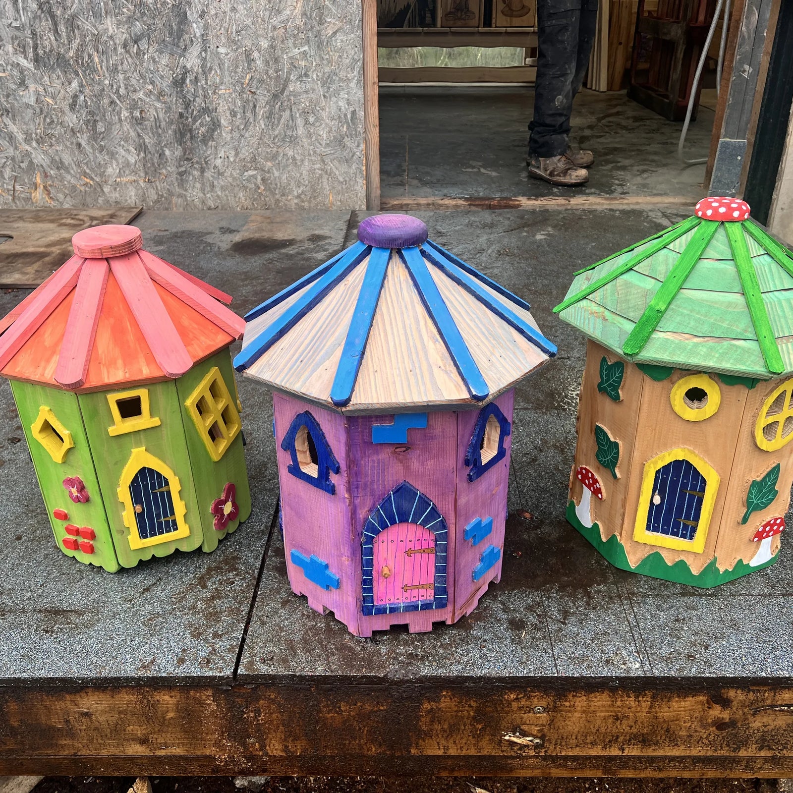 Small handmade hexagonal mini fairy cottage with hand-painted door, windows and natural timber walls