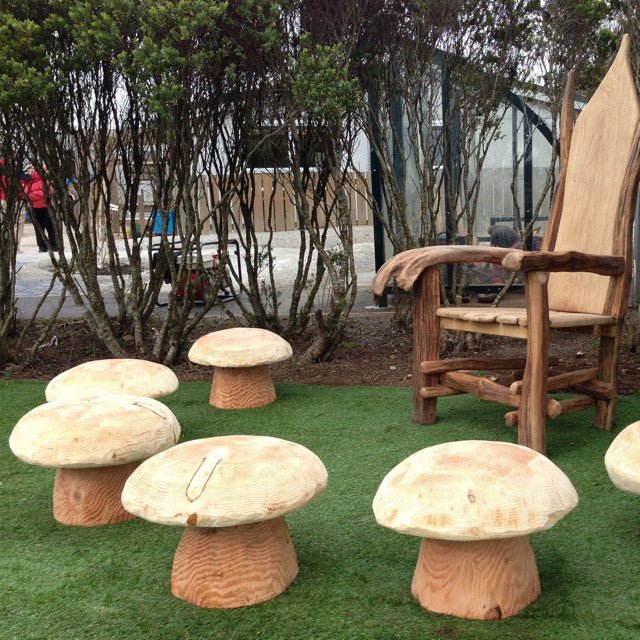 Handmade mushroom stools and carved oak chair in garden — bespoke, Wales