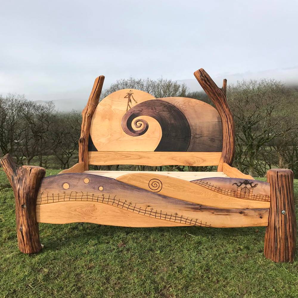 Handcrafted solid oak Nightmare Before Christmas bed with carved Jack Skellington and Halloween motifs — bespoke fantasy bed frame, Wales