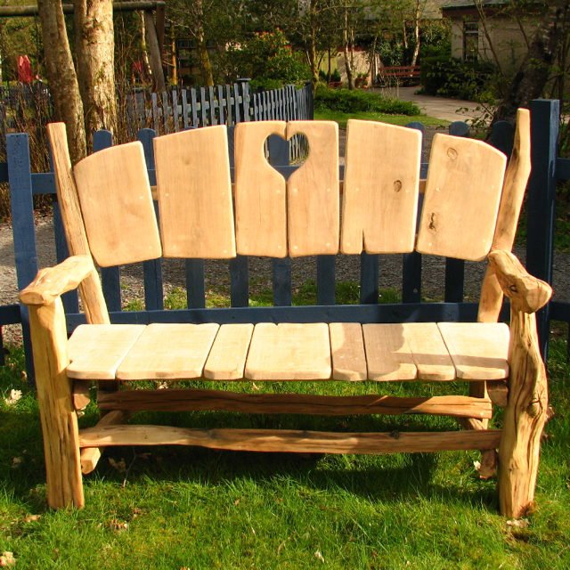 Rustic handmade oak heart fan bench — bespoke carved garden seating, Wales
