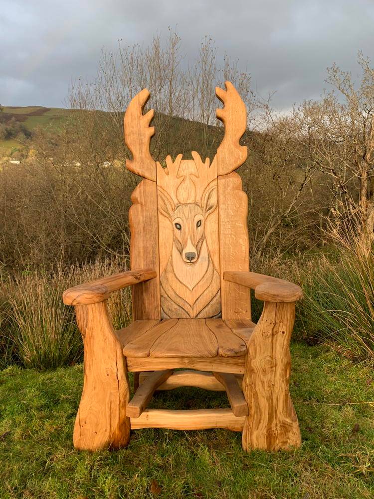 Stag Storytelling Chair on grassy hill