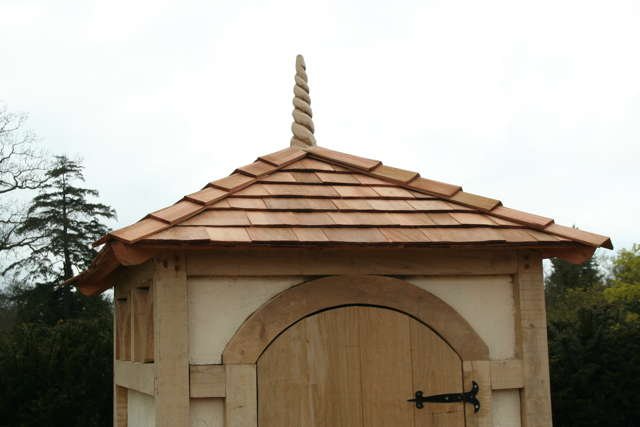 Handcrafted shingle roof sentry shed — bespoke oak timber frame garden structure, Wales