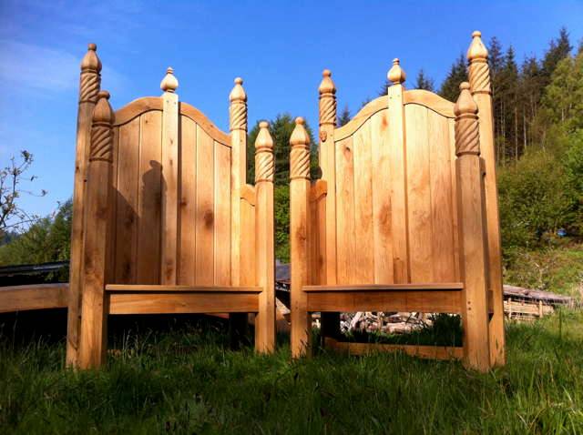 Pair of ornate hand-carved oak storytelling chairs with carved posts — bespoke, Wales