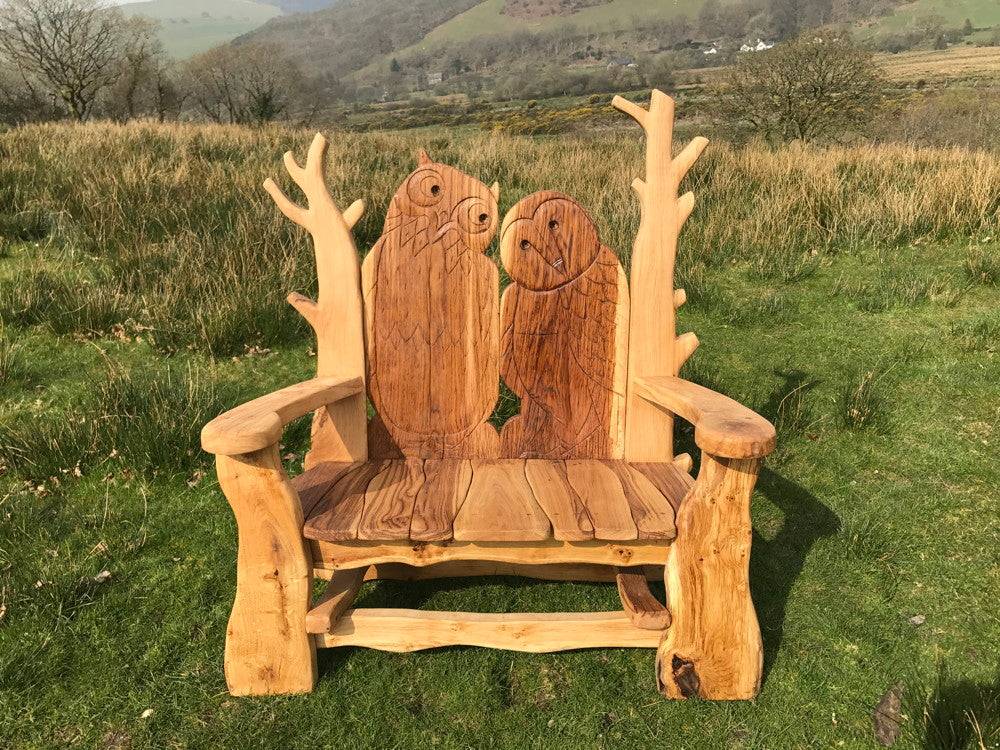 Handcrafted solid oak garden bench in sun — bespoke outdoor seating, Wales