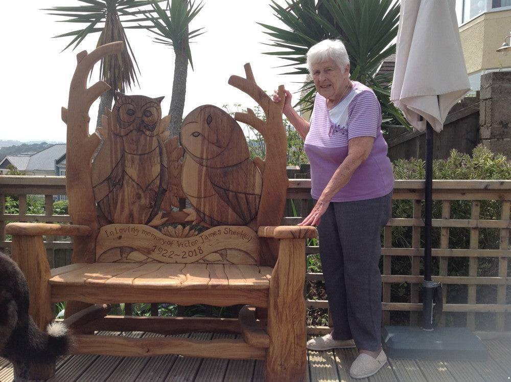 Carved owl motif on handmade solid oak memorial bench — bespoke tribute seating, Wales