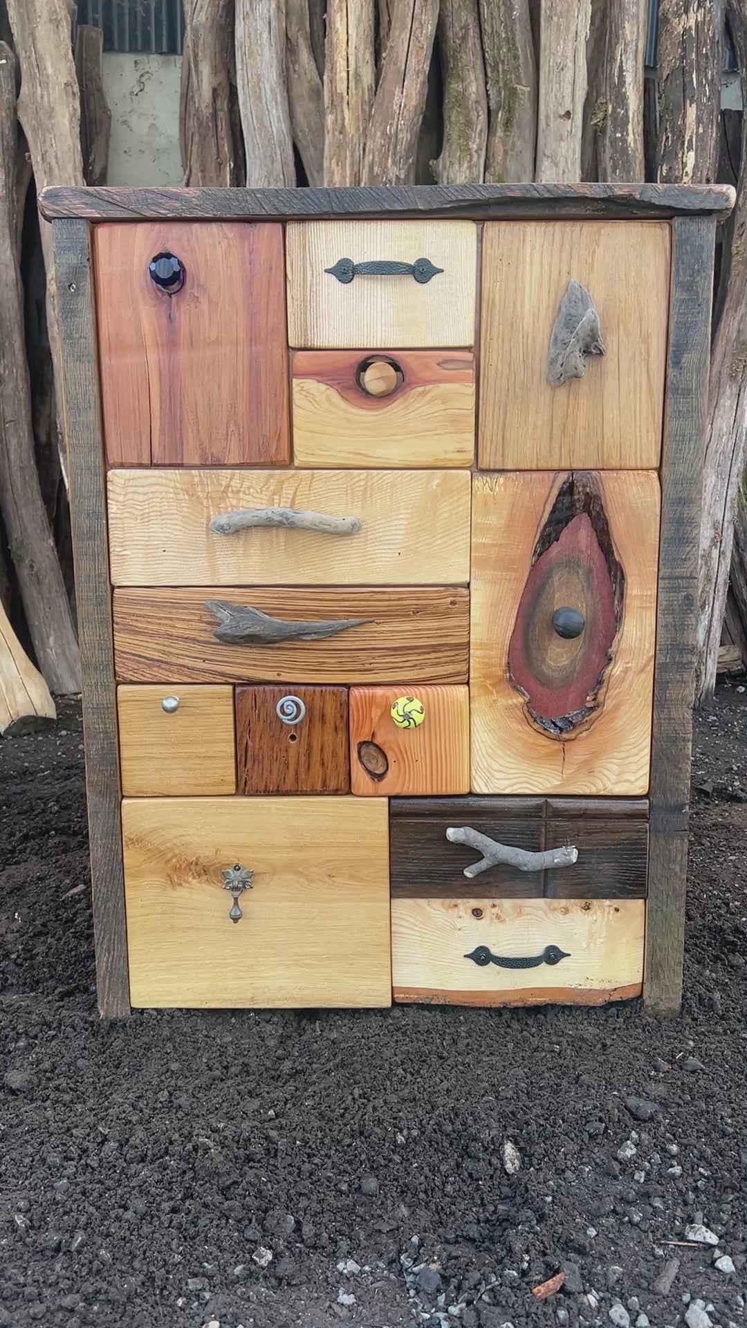 Video of quirky drawer knobs and natural textures on handcrafted wooden furniture

