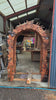 front view of fantasy carved wooden arch with woodland animals owls birds fox and leaves