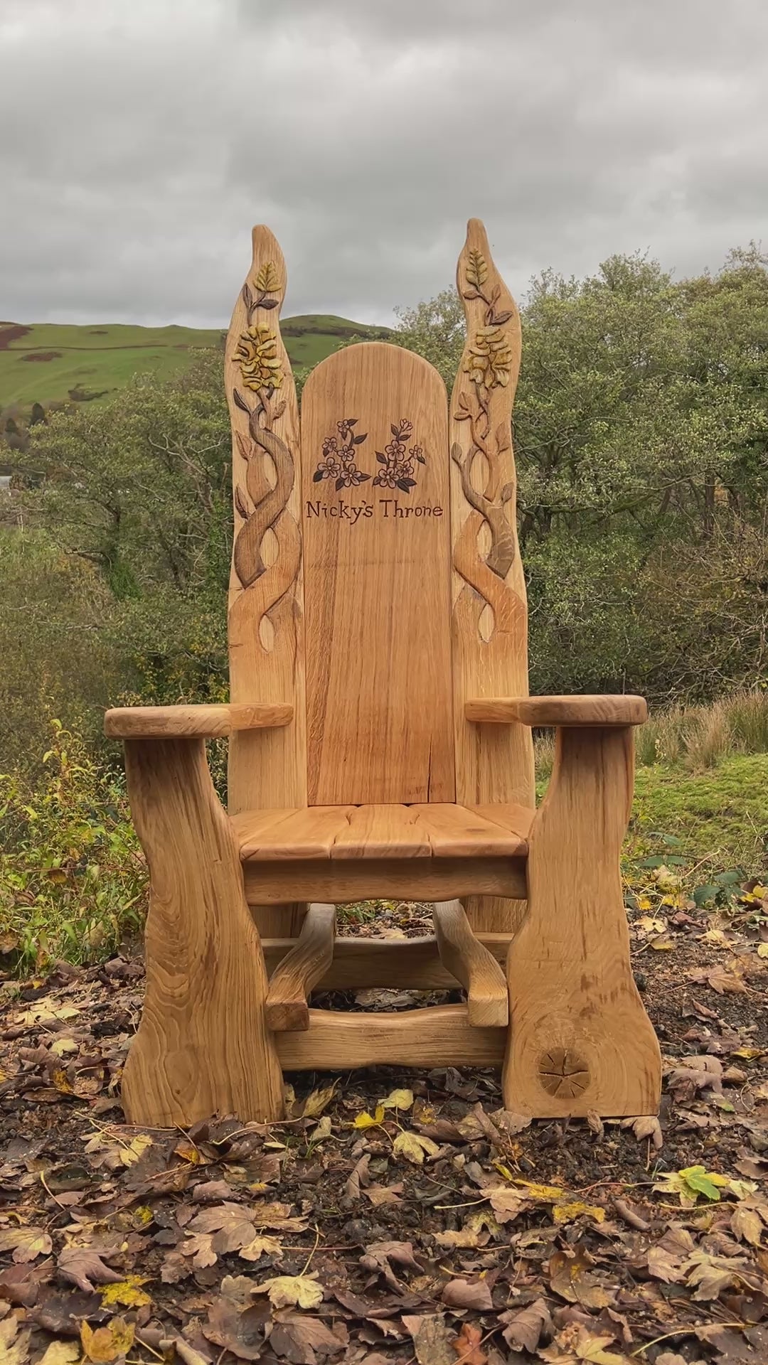 oak throne chair with carved flowers and vines