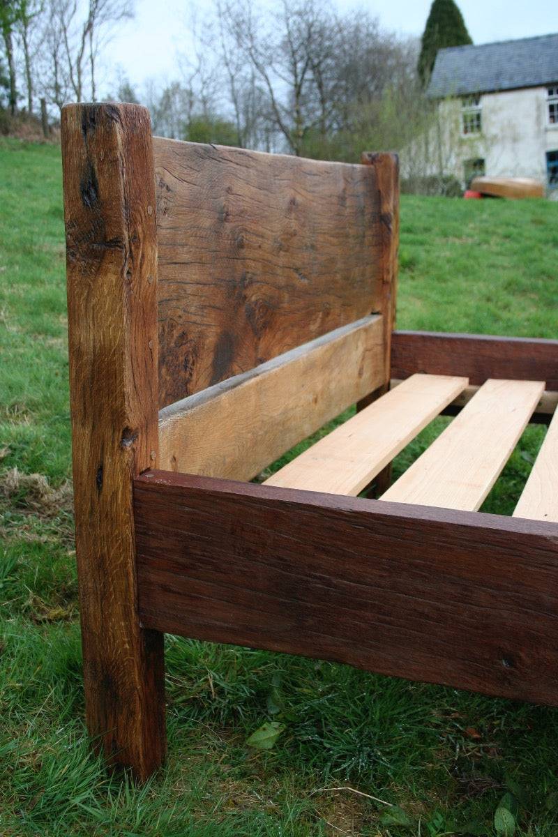 Detailed view of handmade oak bed corner post — reclaimed oak, bespoke, Wales