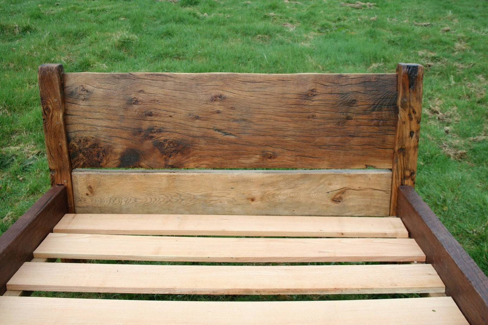 Close-up of handmade rustic reclaimed oak bed headboard — bespoke, Wales