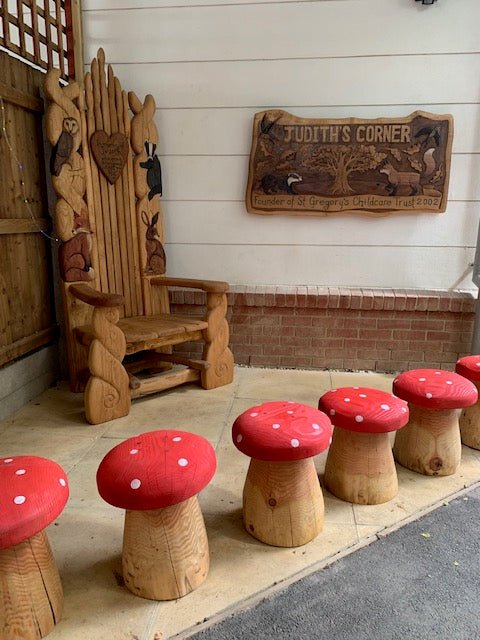 Handmade red mushroom stool — carved wood fantasy garden seating, Wales