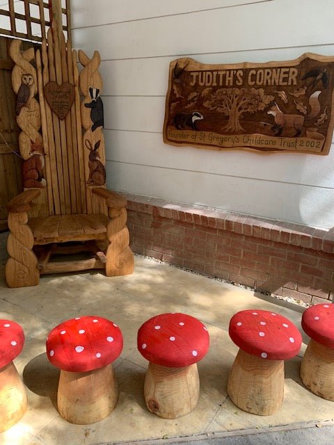 Carved red mushroom stool — handmade fantasy garden seating, Wales