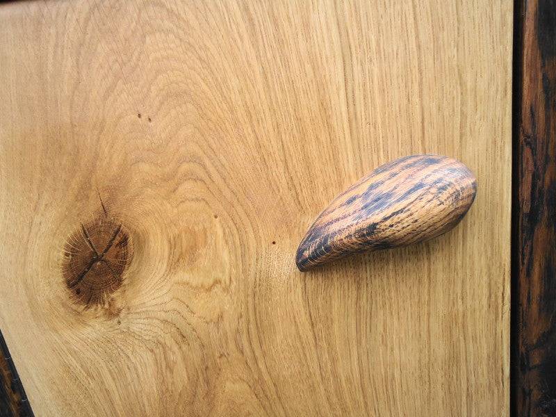 Handmade rustic oak bedside table showing door detail — bespoke solid oak furniture, Wales