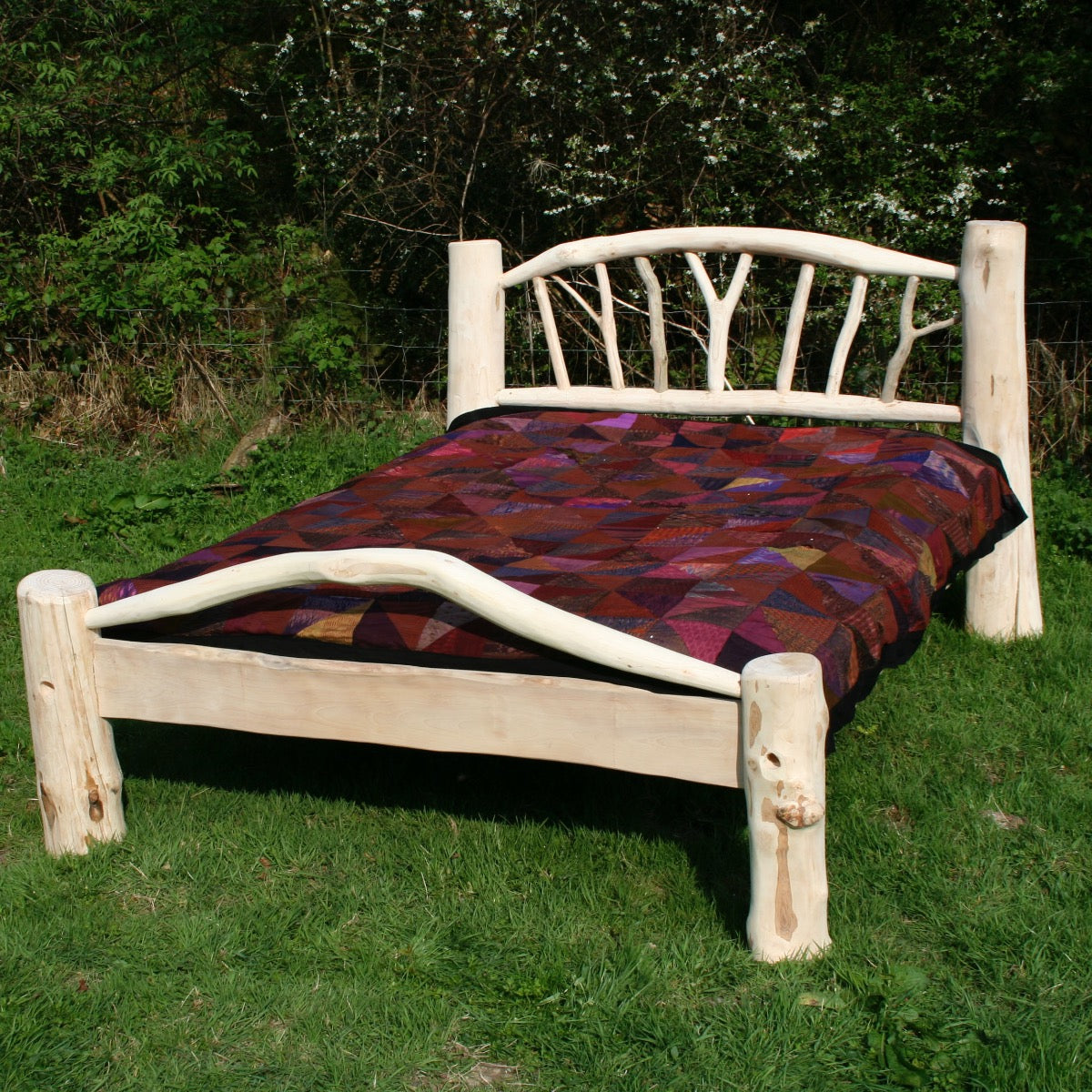 Rustic driftwood bed frame handcrafted from Welsh driftwood, showcasing natural beauty, strength, and a smooth oiled finish. Available in king and double sizes.

