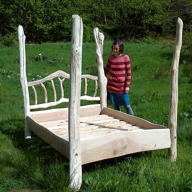 Rustic driftwood four poster canopy bed frame, handmade in Wales with sustainably sourced timber and unique coastal driftwood, perfect for natural decor