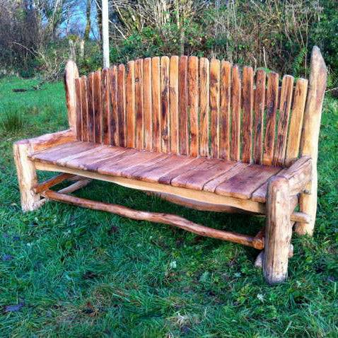 Rustic Giant Storytelling Bench handcrafted from reclaimed Welsh oak, perfect for gardens, parks, and communal outdoor spaces.

