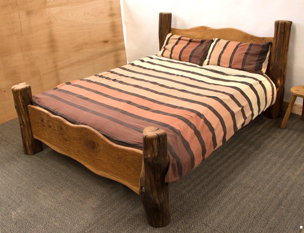 Handmade rustic solid oak bed with pillows — bespoke bedroom furniture, Wales