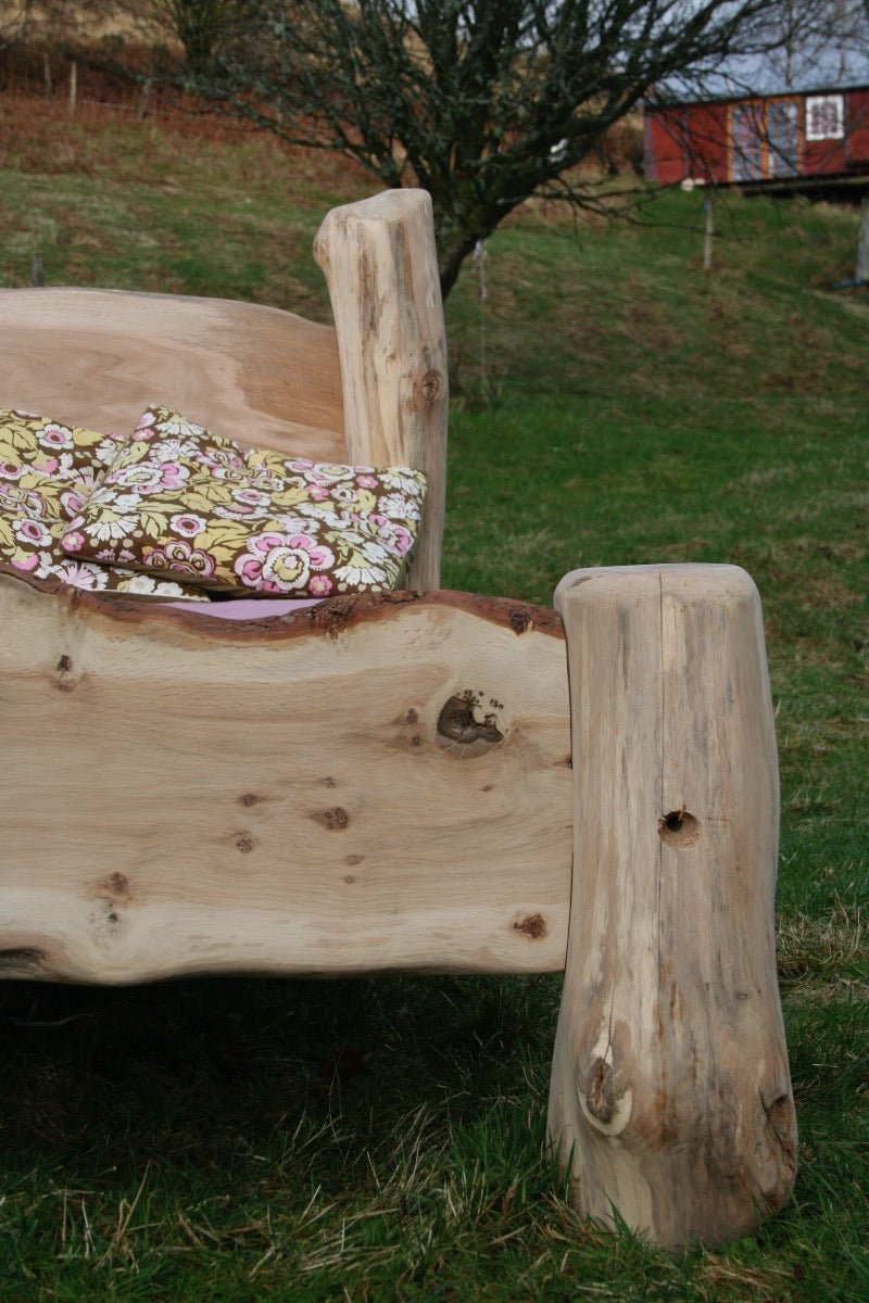 Oak driftwood bed leg detail on handmade rustic bed — natural wood bespoke furniture, Wales