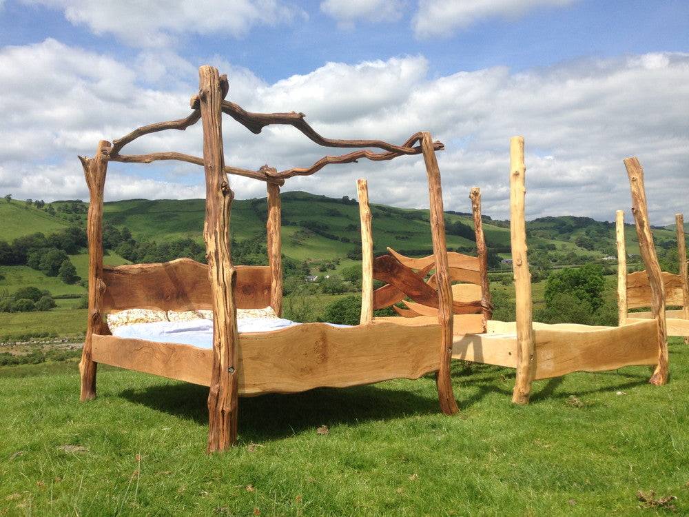 Rustic oak four poster tree bed in garden — handmade bespoke bedroom furniture, Wales