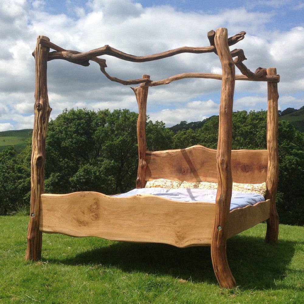 Rustic oak four poster tree bed — handcrafted natural branch bedroom furniture, Wales