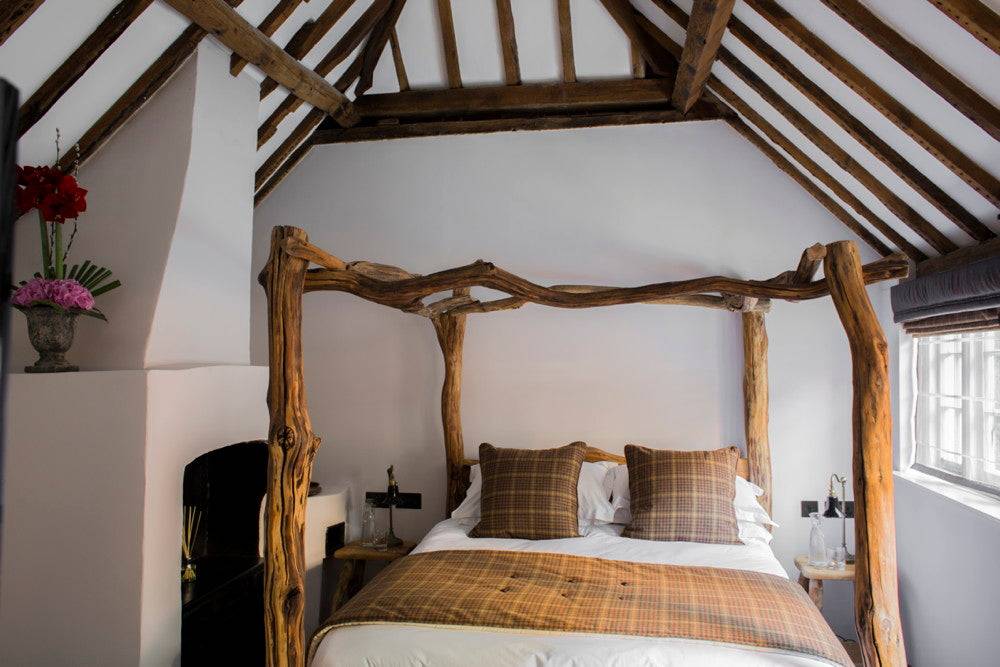 Rustic oak four poster bed frame — handcrafted natural tree bed, Wales