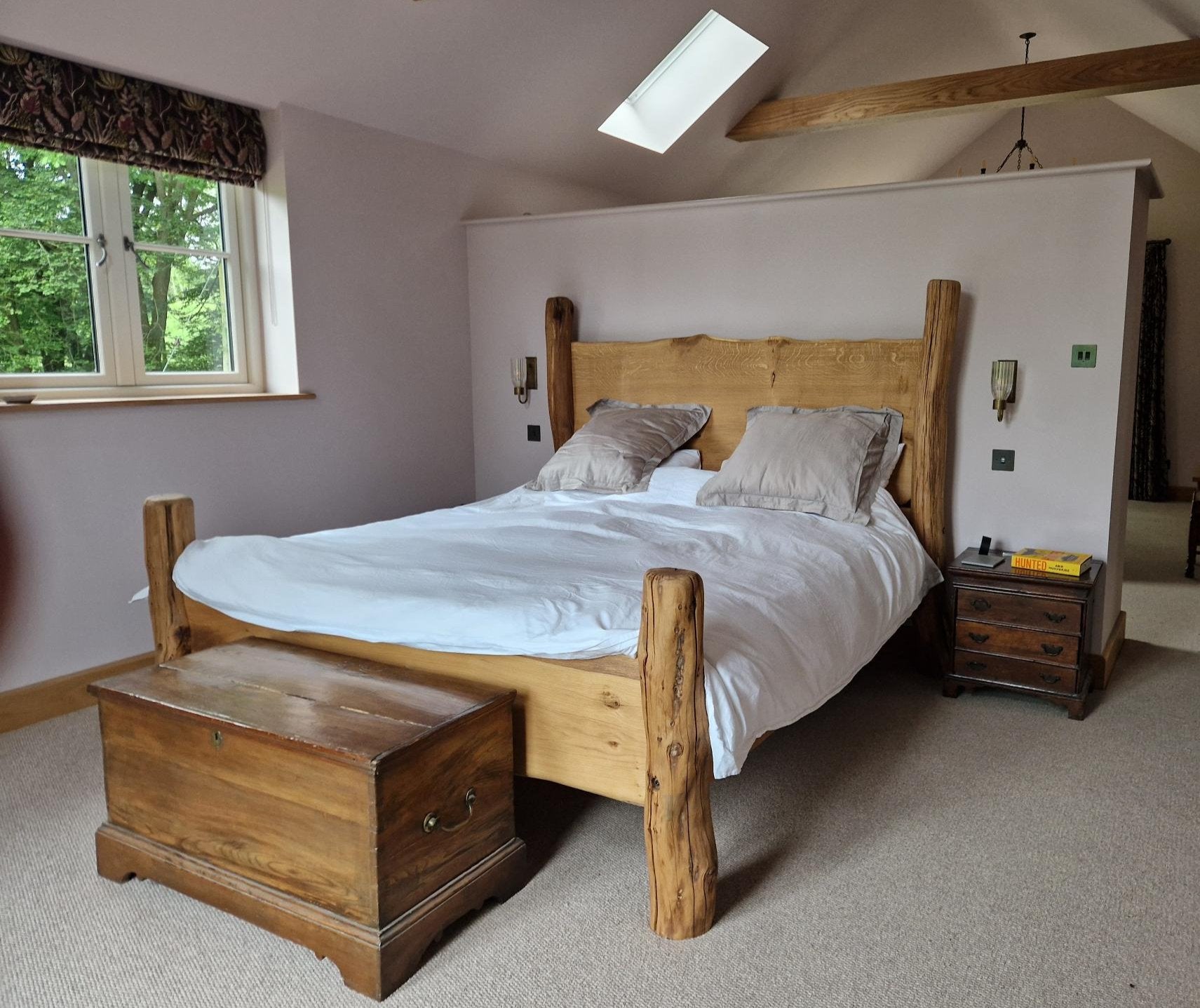 rustic oak bed with high headboard in customer's bedroom