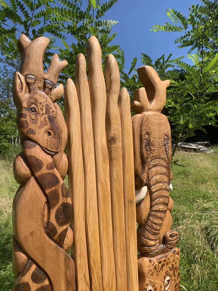 Giraffe and elephant carved on handmade oak safari chair — bespoke African wildlife throne, Wales