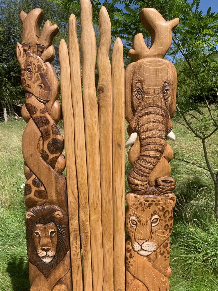 African animals carved on handmade oak safari storytelling chair — bespoke wildlife throne, Wales