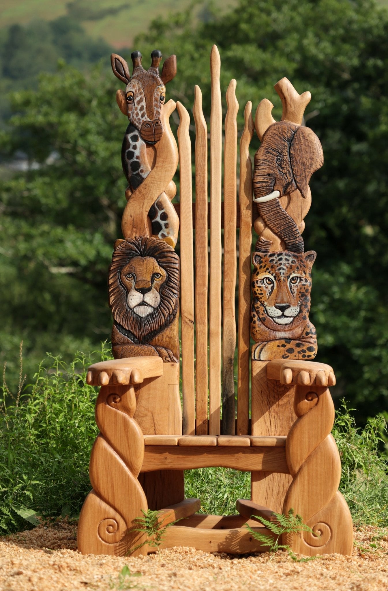 Handcrafted oak safari storytelling chair with African animal carvings — bespoke wildlife throne, Wales