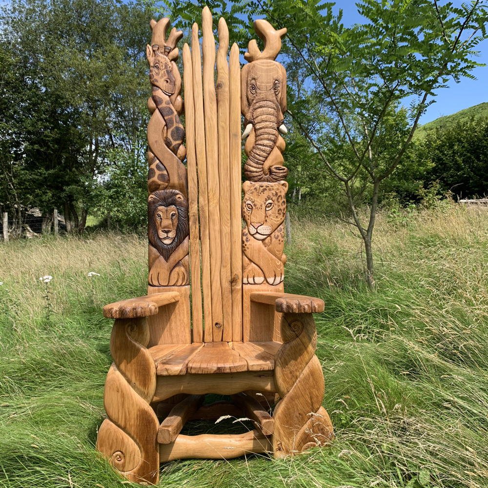 Handcrafted African safari carved oak story chair — bespoke wildlife storytelling throne, Wales