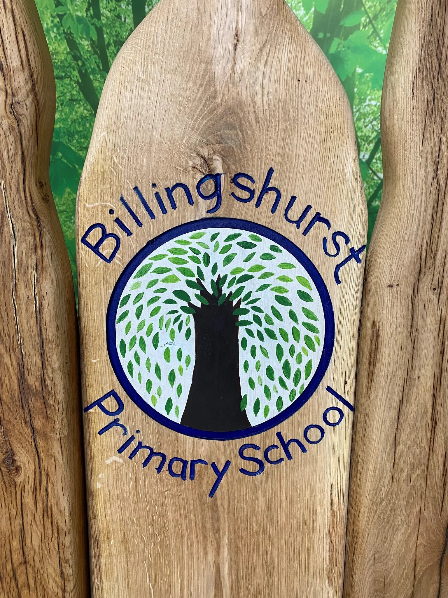 Close-up of the Billingshurst Primary School tree logo painted on a storytelling chair backrest