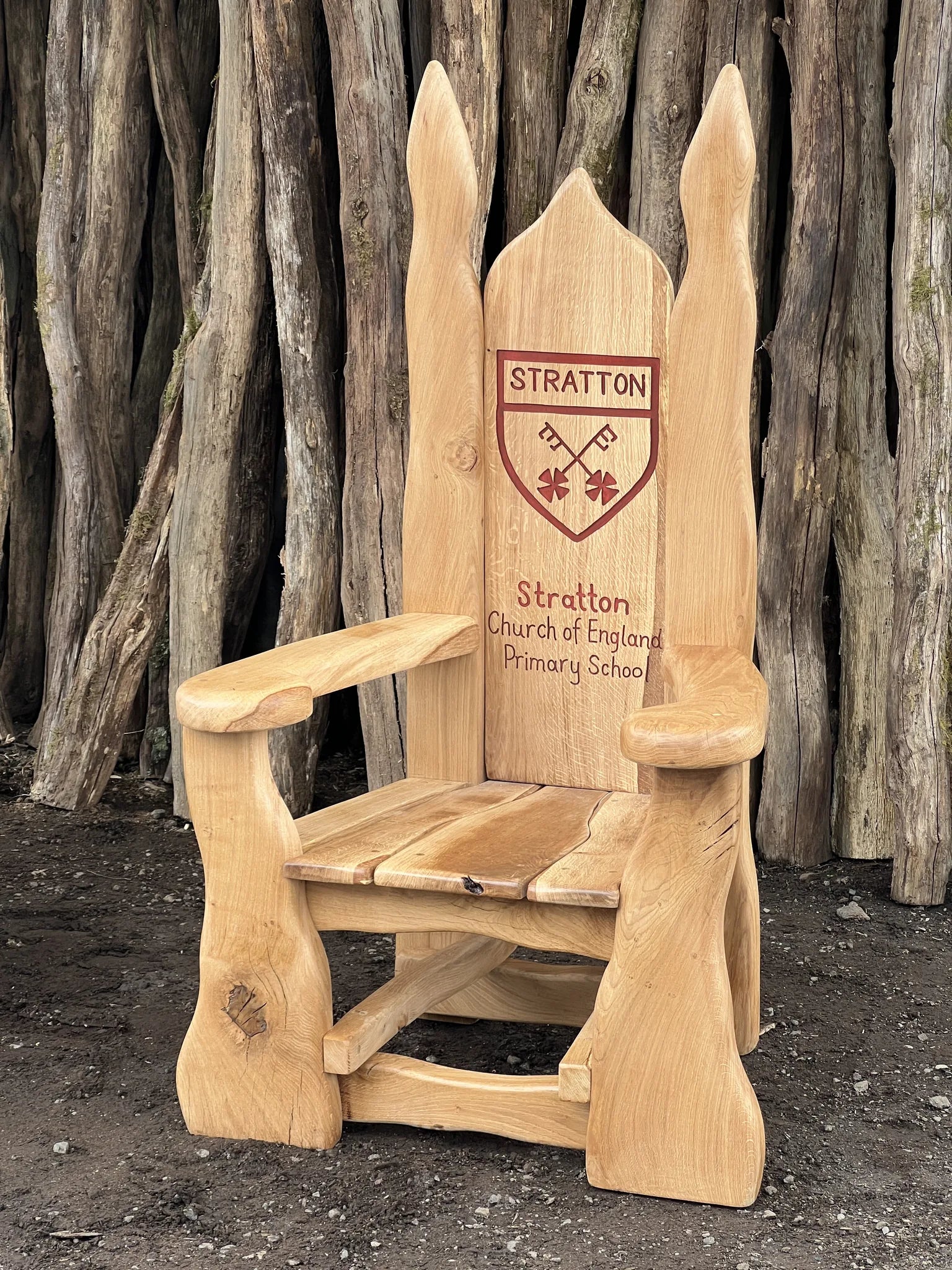 Personalised school storytelling throne for Stratton Church of England Primary School in solid oak