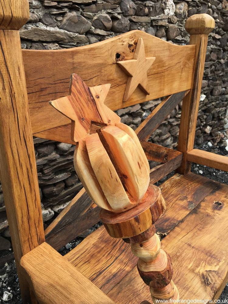 Carved oak story bench from Celebrity Desert Island — bespoke handmade outdoor furniture, Wales
