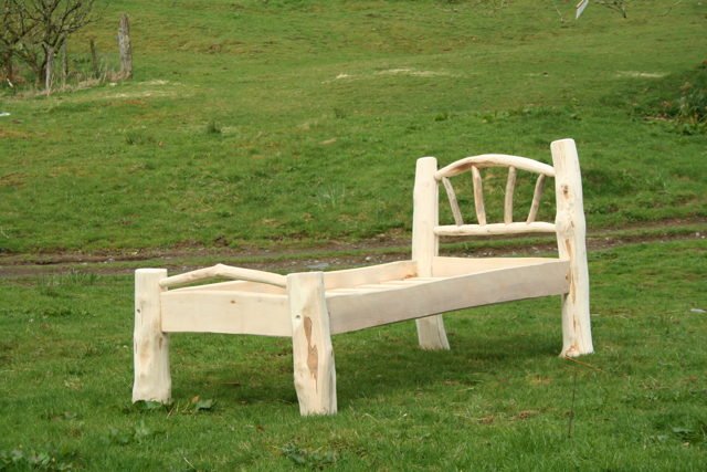 Handmade Flintstone-style driftwood single bed — rustic natural wood, bespoke, Wales