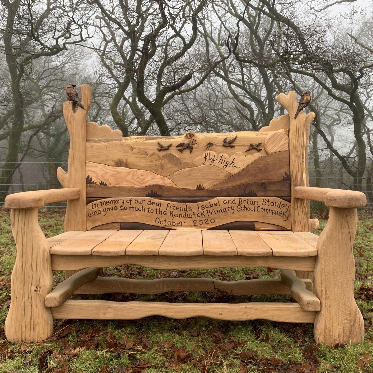 Rustic handmade oak memorial wooden bench with carved skylark — bespoke tribute seating, Wales