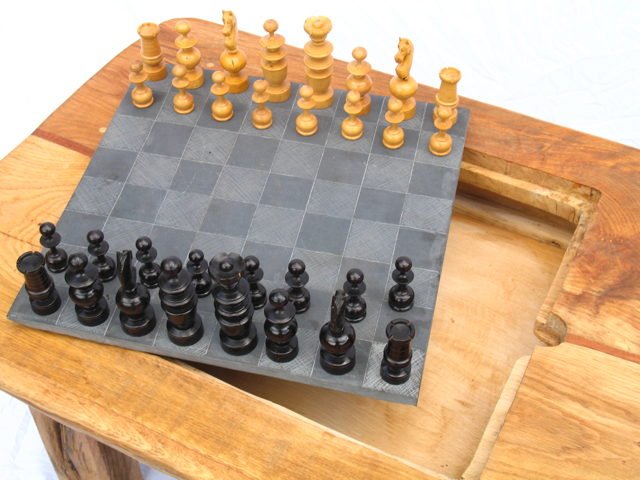 Chess pieces on handmade slate chess table — bespoke oak game table, Wales
