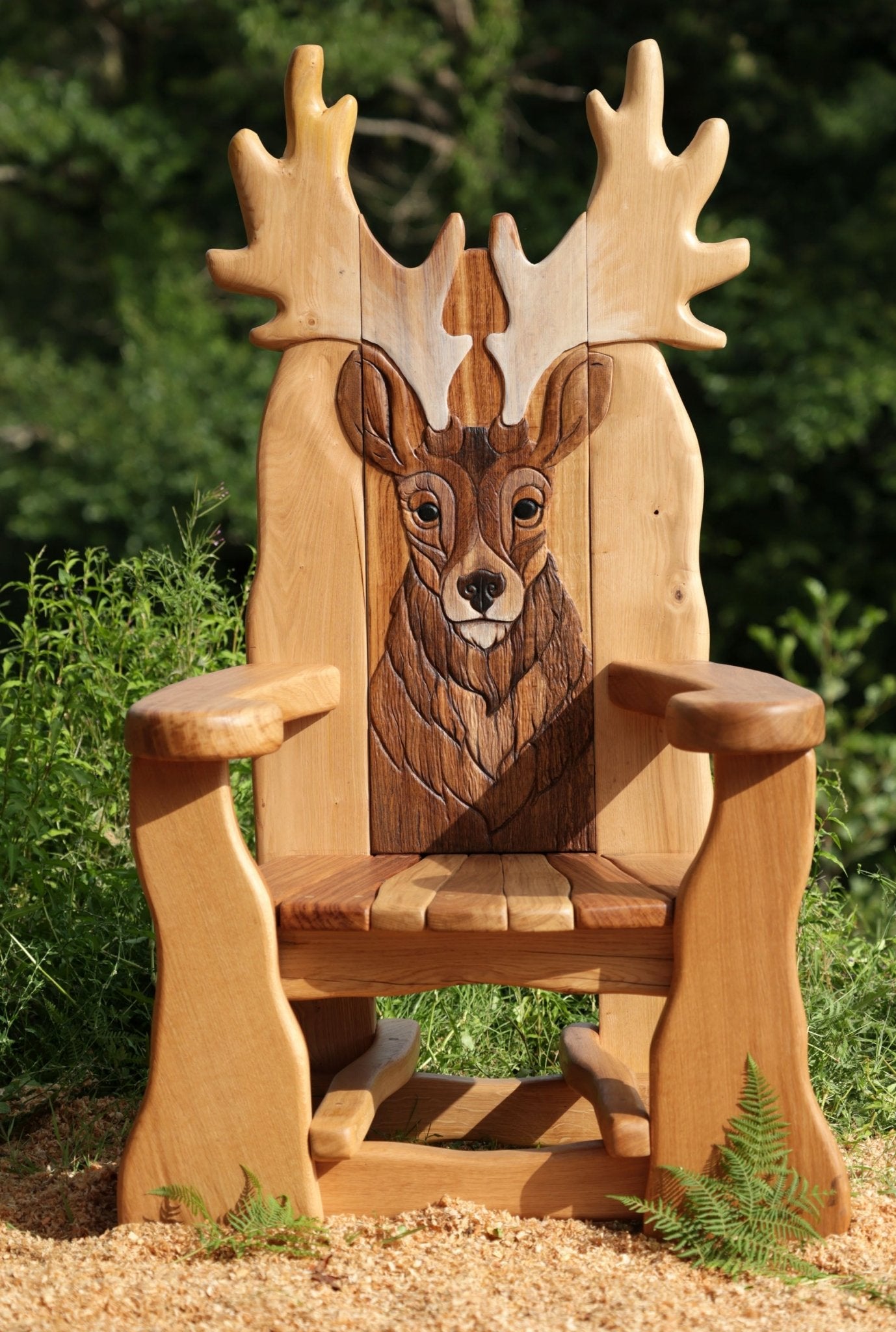 Wooden storytelling chair with stag backrest