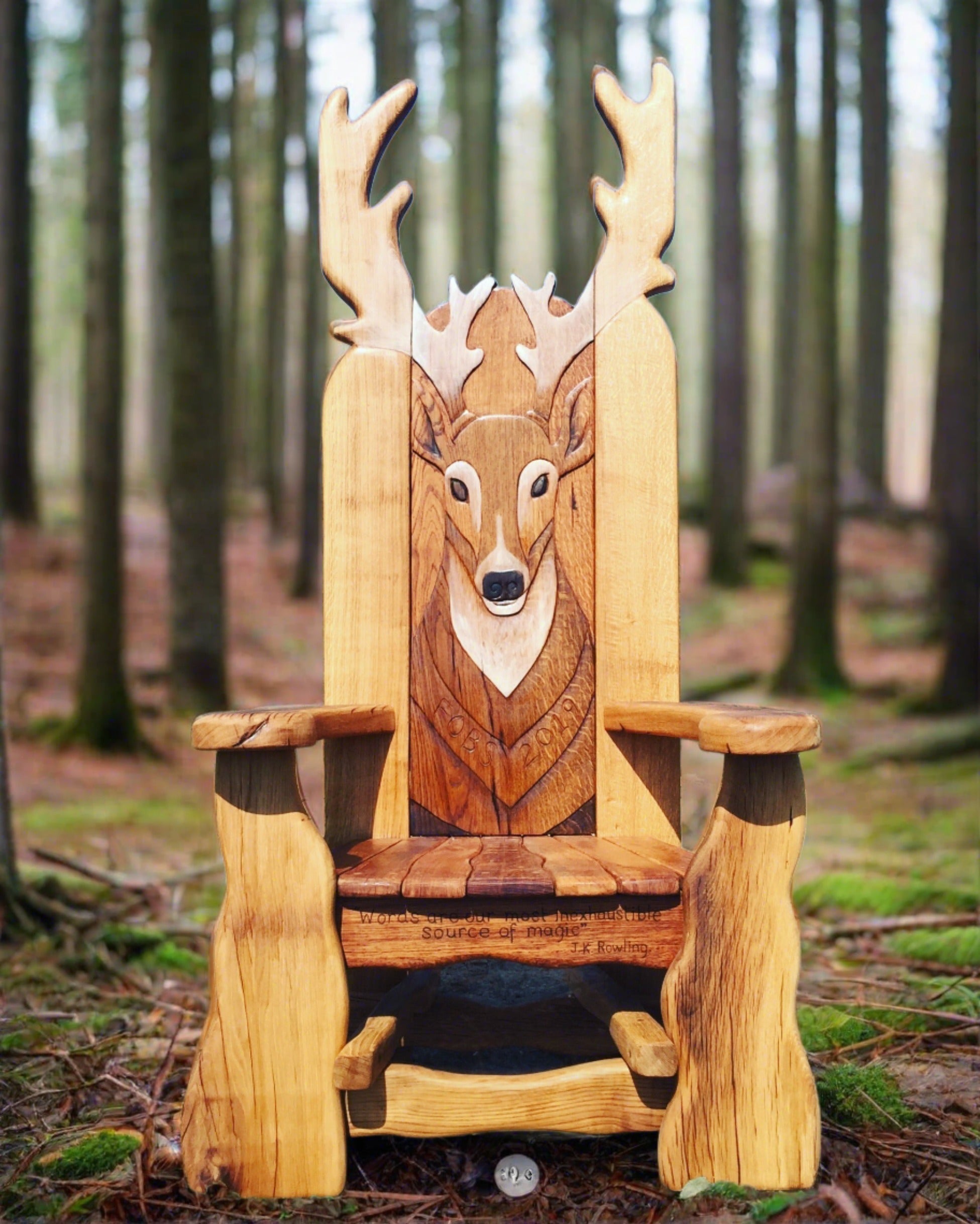 Wooden chair with carved deer design