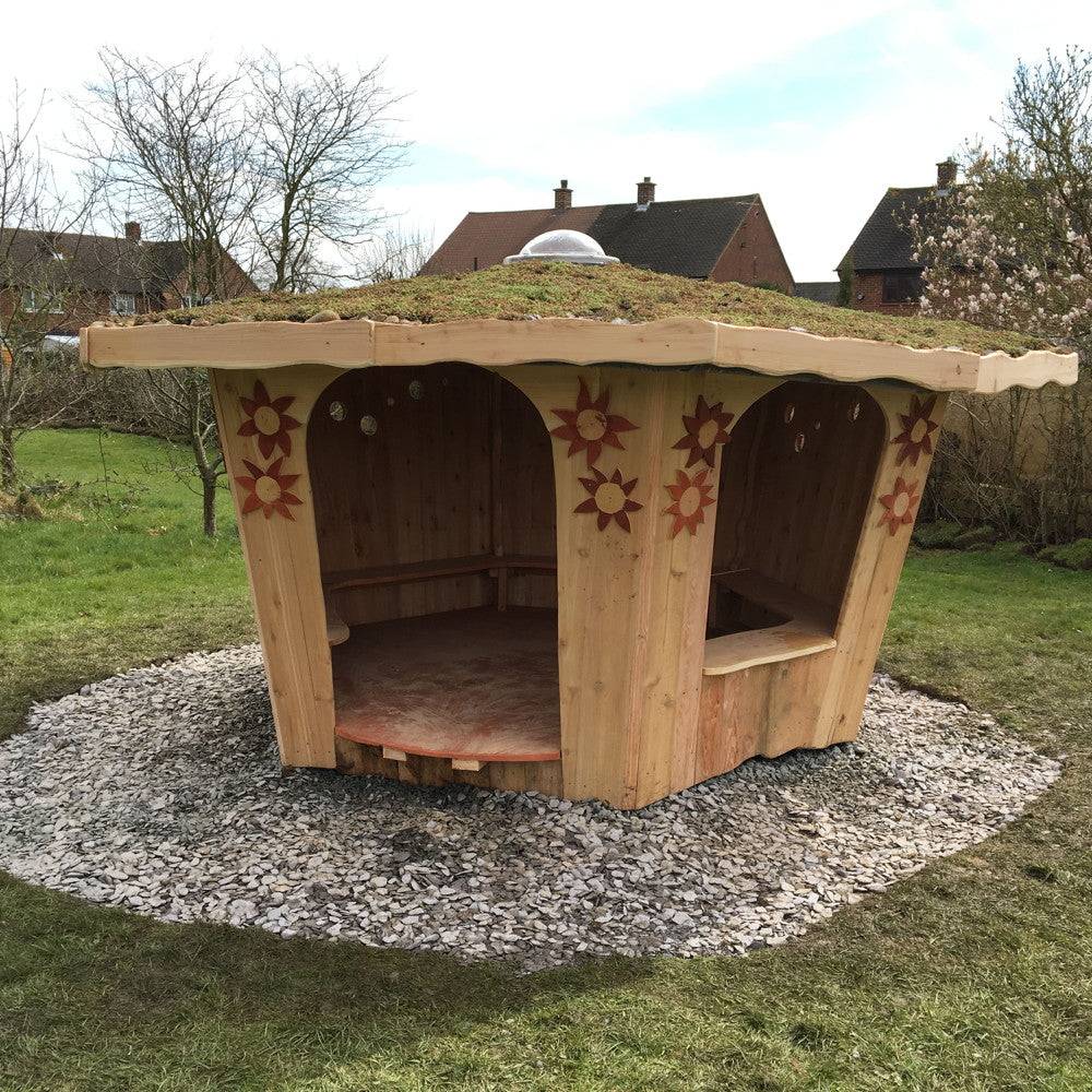 Handmade playground shelter for school — timber frame storytelling house, Wales