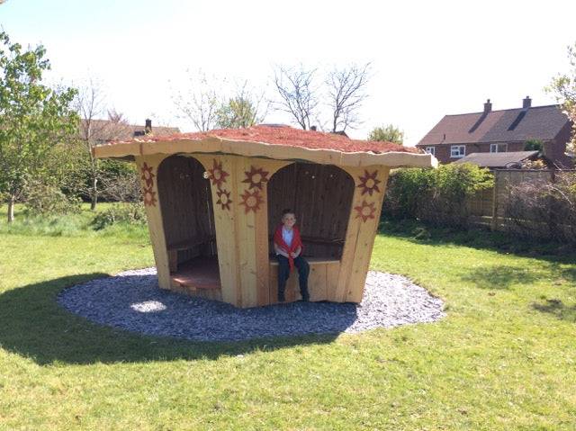 Handcrafted wooden playground shelter — bespoke outdoor school structure, Wales