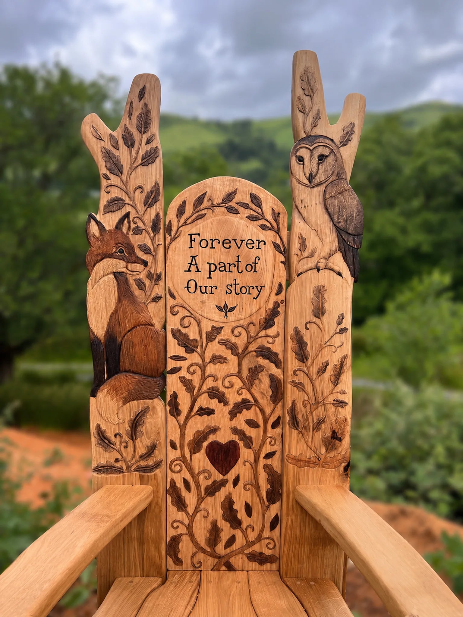 Carved oak back panel of a storytelling throne with fox, barn owl, oak leaves and a personalised text plaque