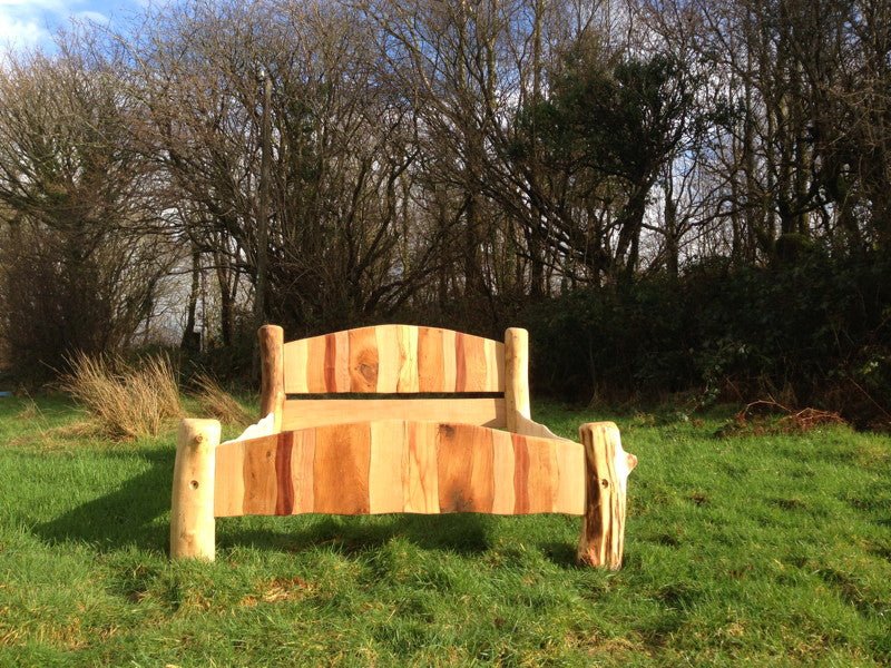 Stripy driftwood bed with colourful wood panels — handcrafted sustainable bedroom furniture, Wales