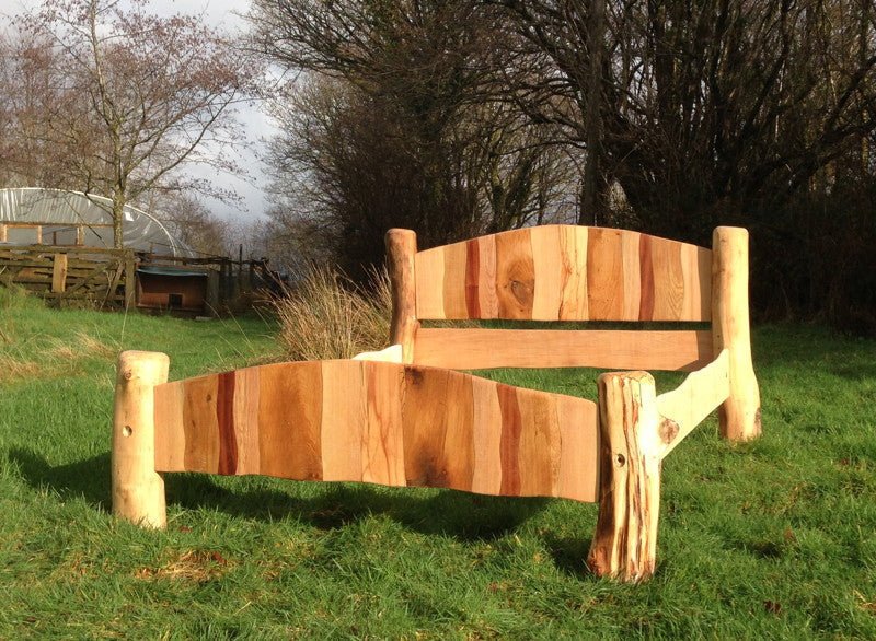 Handcrafted reclaimed wood stripy bed frame — sustainable driftwood bedroom furniture, Wales