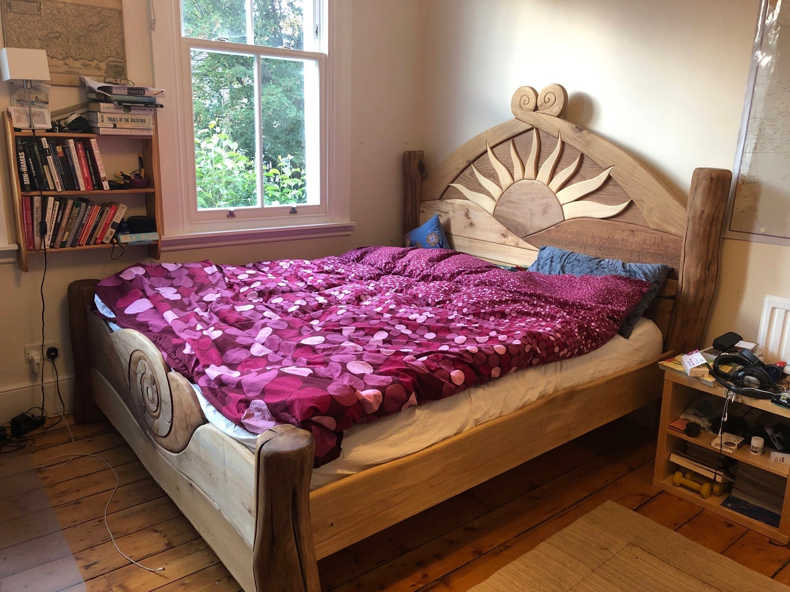 Solid handmade wooden sunshine bed frame — bespoke carved bedroom furniture, Wales