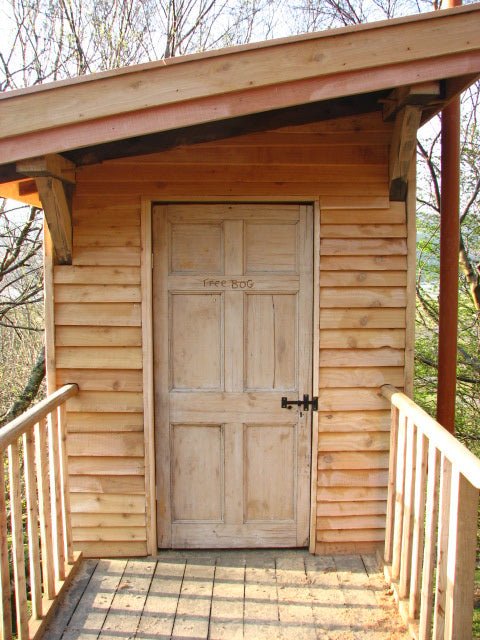 Front view of tree bog composting toilet — handmade timber eco toilet, Wales