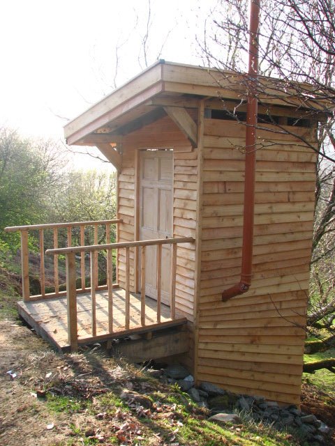 Side view of tree bog compost toilet — sustainable timber eco toilet, handmade Wales