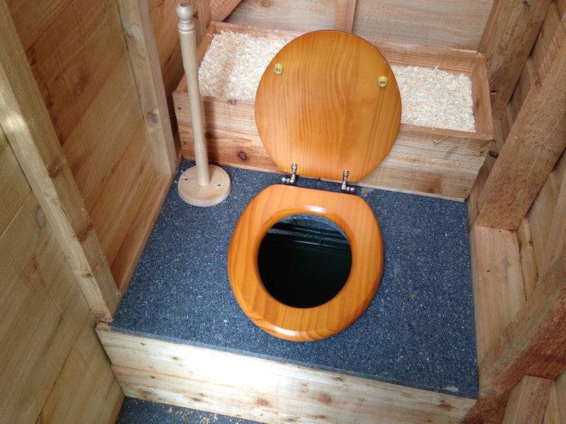 Interior seat of triple composting toilet block — sustainable timber, handmade Wales