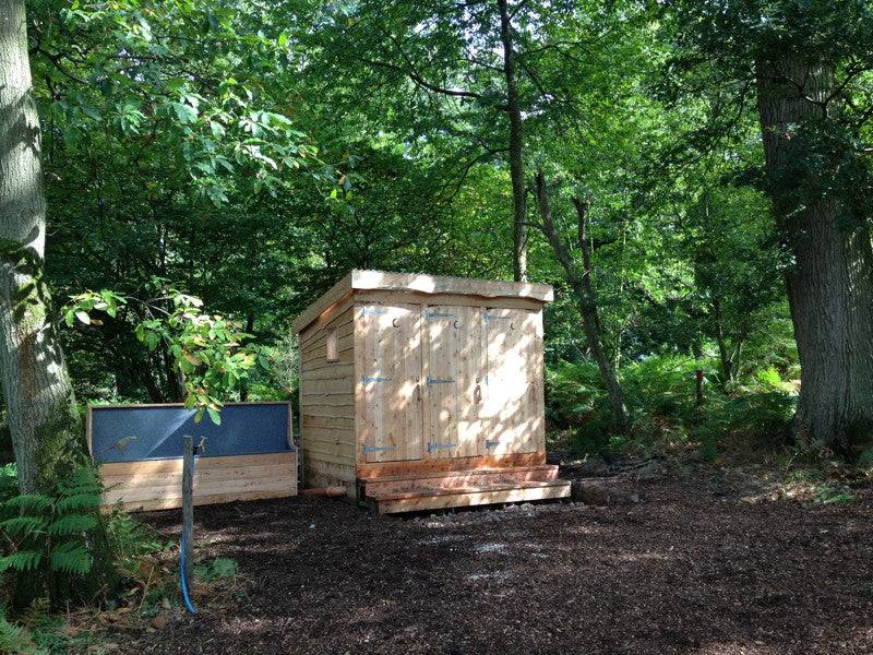 Triple compost toilet block in woodland setting — eco sanitation, handmade UK