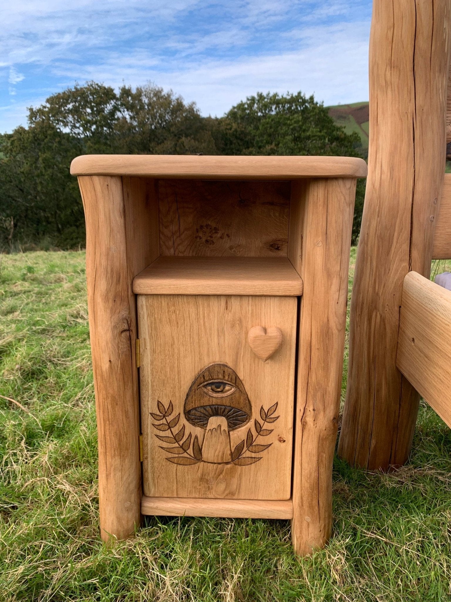 Solid oak bedside table with carved mushroom design — bespoke handmade furniture, Wales