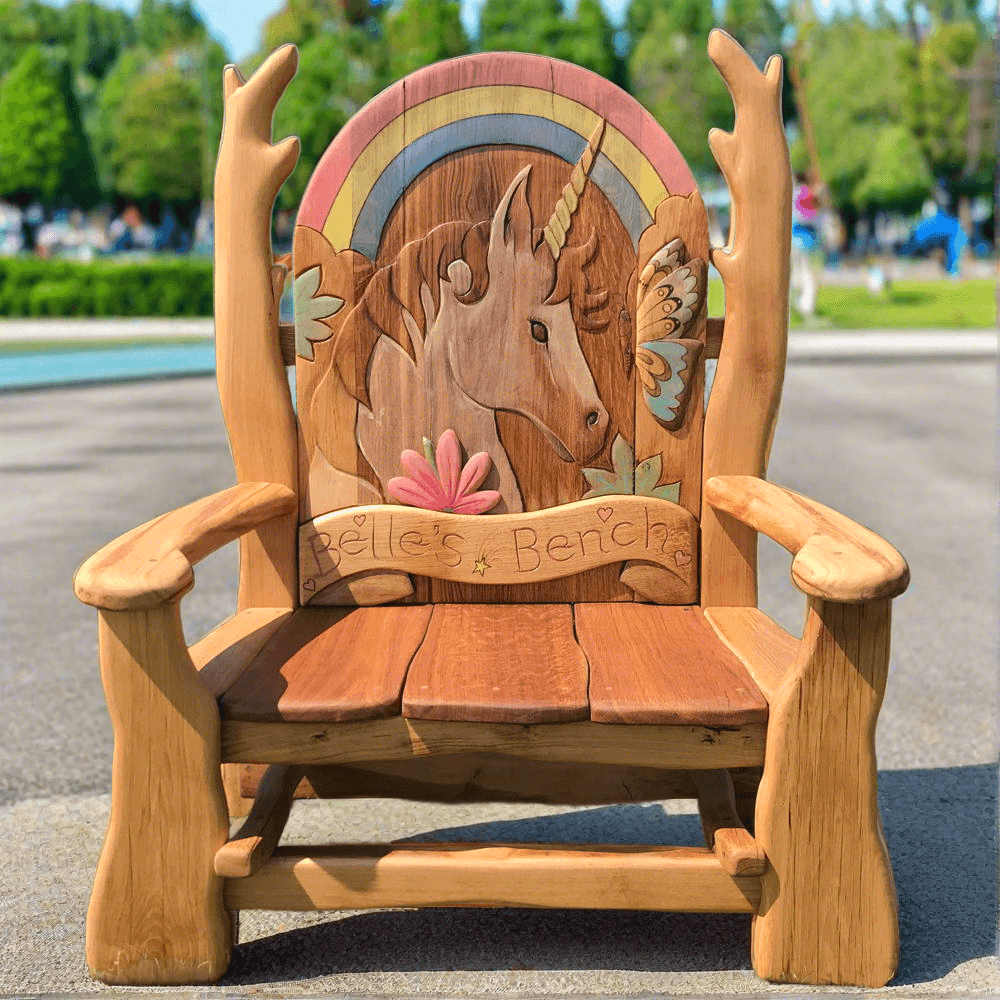 Handcrafted Unicorn Memorial Wooden Bench made from oak, featuring a rainbow and intricate unicorn carvings, ideal for schools or commemorative spaces.

